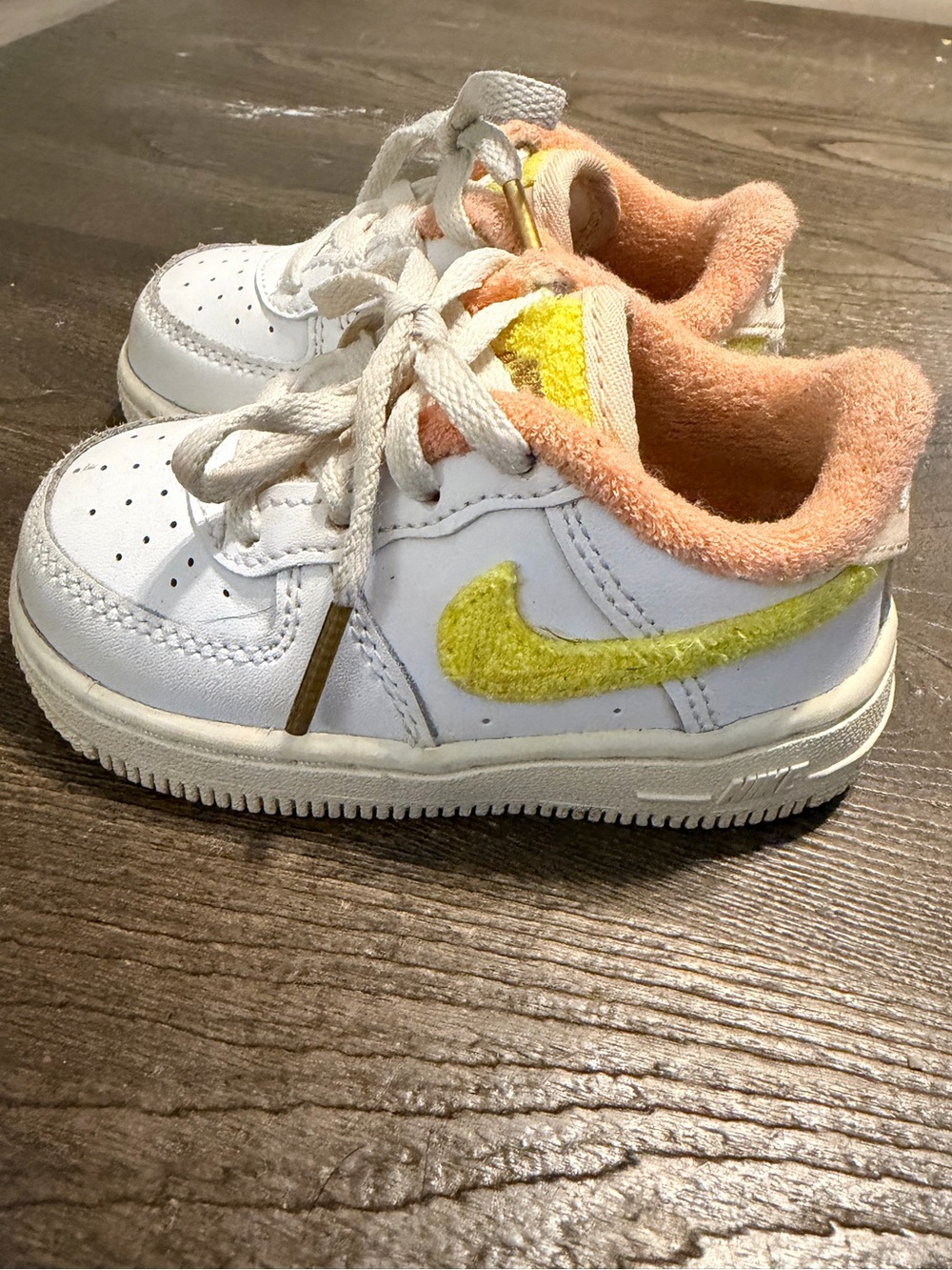 Nike Kids White Sneakers with Yellow Swoosh and Peach Lining